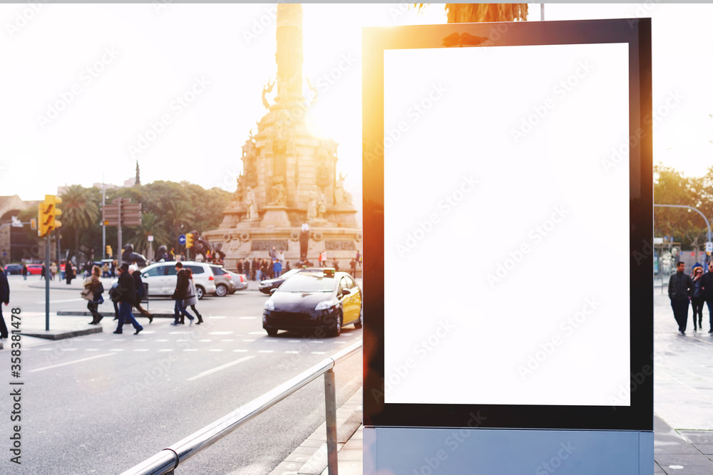 Blank billboard with copy space for your text message or content, outdoors advertising mock up, public information board on city road, flare sun light. Empty Lightbox on urban setting sidelines - obrazy, fototapety, plakaty 