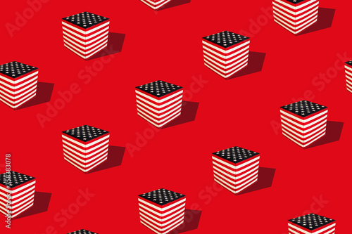 Flat lay colorful pattern with american flag cube on red background. Trendy mockup or wallpaper. Minimal July 4th USA independence day concept with sharp shadows.