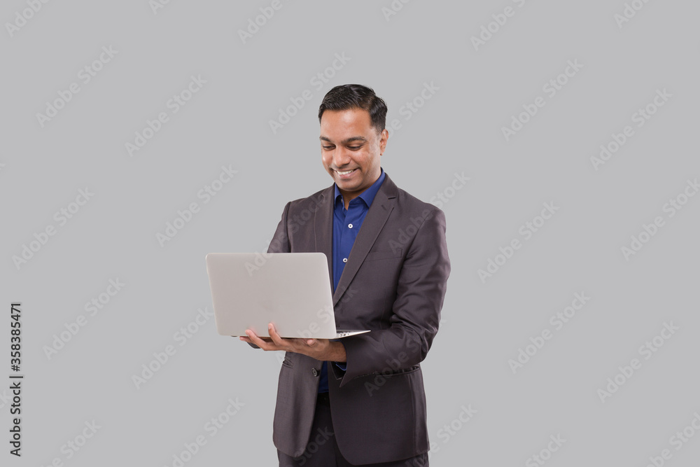 Businessman Using Laptop Green Screen Isolated. Indian Business man with Laptop in Hands. Online Business Concept Businessman Using Laptop Green Screen Isolated. Indian Business man with Laptop in Hands. Online Business Concept