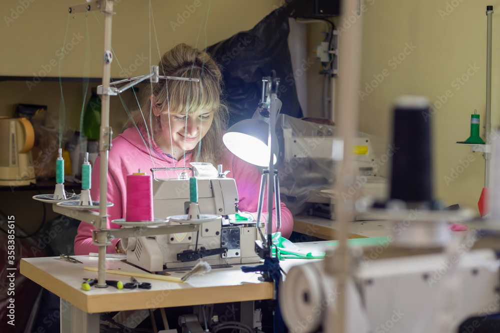 Garment worker works for an industrial sewing machine