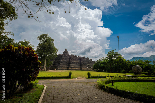 Borobudur temple view with bright cloudy blue sky photo