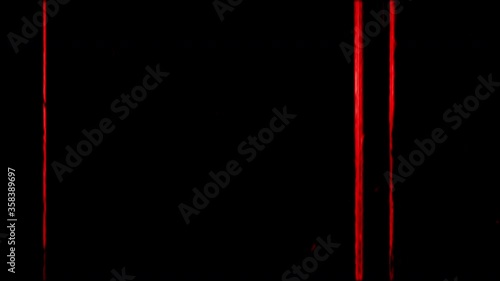 Hand written red colored markers and lines on noisy tape. High contrast. Isolated on black. Effect of old film rolling with details, scratches and grain. Vintage strip Intro. Film Burn FX Effect in 4K