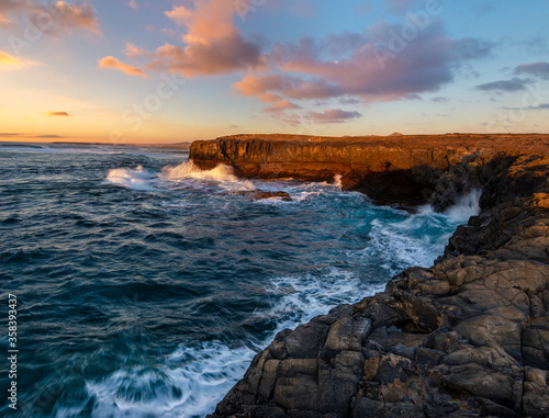 rocky cliff in Fuerteventura during a storm at sunset