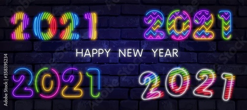 Big set of Colorful neon 2021 Happy New Year Neon banner. Realistic bright neon billboard on brick wall. Concept of holiday card with glowing text. 2021 Neon Text.