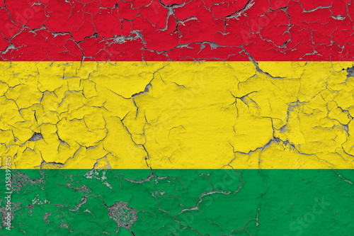 Bolivia flag close up grungy, damaged and weathered on wall peeling off paint to see inside surface. Vintage concept.