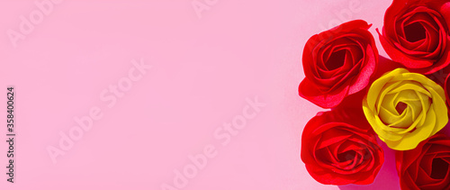 Pink Background of a bouquet of bright roses  top view. Designer blank.