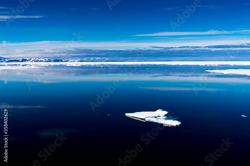 Ice pieces on the water in Arctic © Anton Ivanov Photo