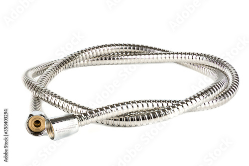 Corrugated metal shower hose isolated on a white background.