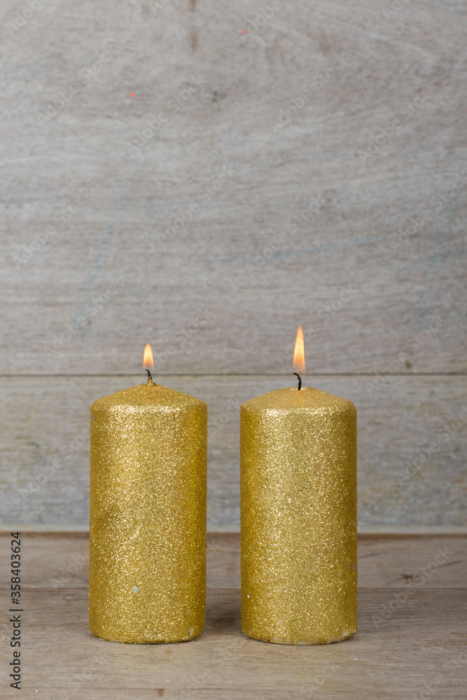 Christmas holidays composition with decorations (gold candles) on white wooden board background with copy space for your text. Christmas holidays composition with decorations (gold candles) on white wooden board background with copy space for your text.
