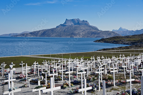 Rugged Mount Sermitsiaq and the bay are a lovely backdrop to the town cemetery, Nuuk, Greenland photo