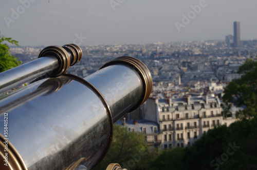 Telescopes pointing out over panoramic view over Paris