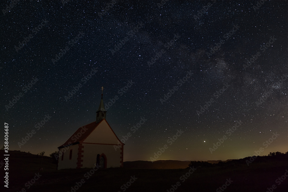 Mystic chapel under clear spangled sky