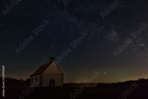 Mystic chapel under clear spangled sky