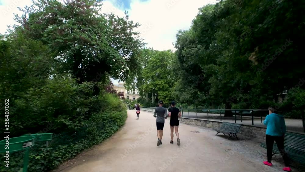 Timelapse people running in the park. Parc Monceau Timelapse people running in the park. Parc Monceau