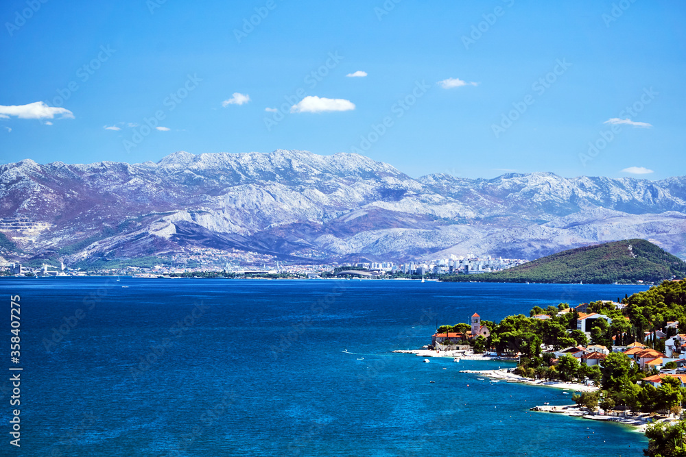 Landscape with the sea coast, mountains and city of Split in Croatia.