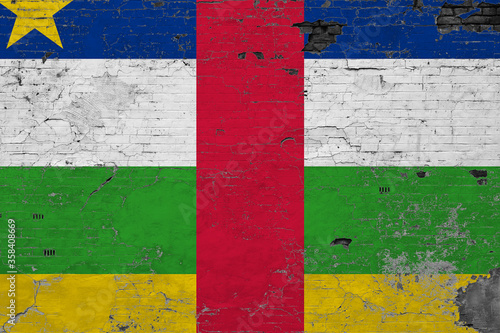 Central African Republic flag on grunge scratched concrete surface. National vintage background. Retro wall concept.