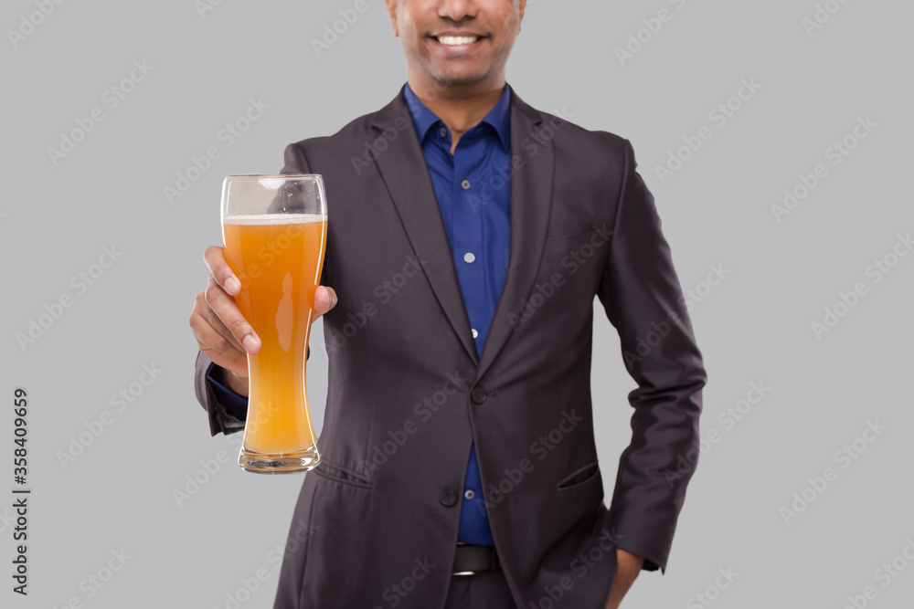Businessman Showing Beer Glass. Indian Business man with Beer in Hand Close Up Businessman Showing Beer Glass. Indian Business man with Beer in Hand Close Up