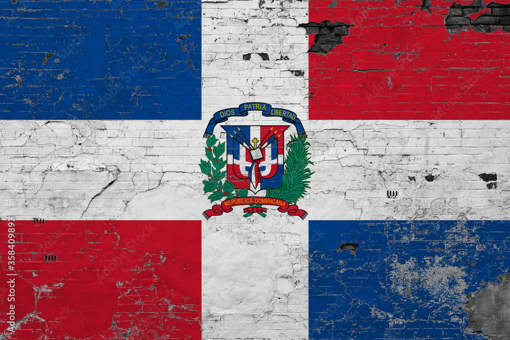 Dominican Republic flag on grunge scratched concrete surface. National vintage background. Retro wall concept.