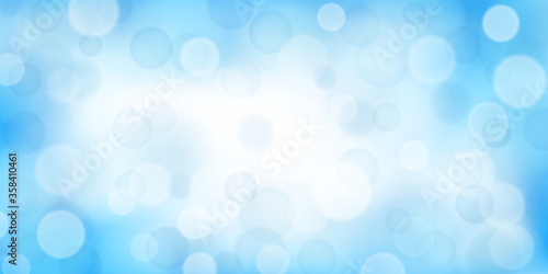 Abstract background with bokeh effects in light blue colors