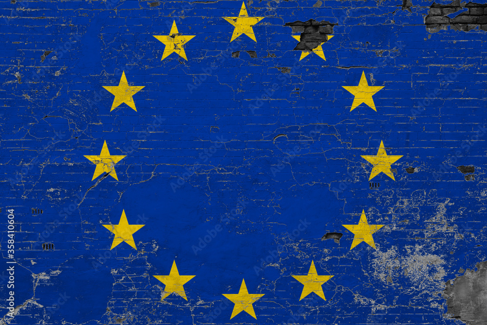 European Union flag on grunge scratched concrete surface. National vintage background. Retro wall concept. European Union flag on grunge scratched concrete surface. National vintage background. Retro wall concept.