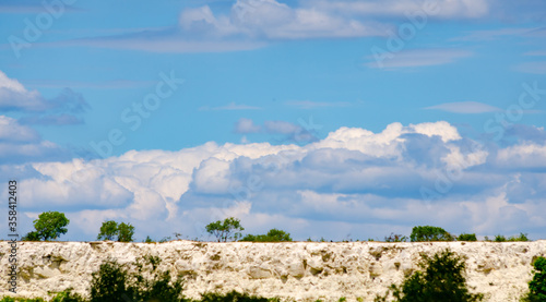 Beautiful landscape at Houghton Regis Quarry with fluffy clouds.