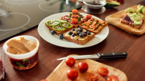 Set with toast bread and different healthy vegetarian toppings. Vegetarianism, healthy food concept