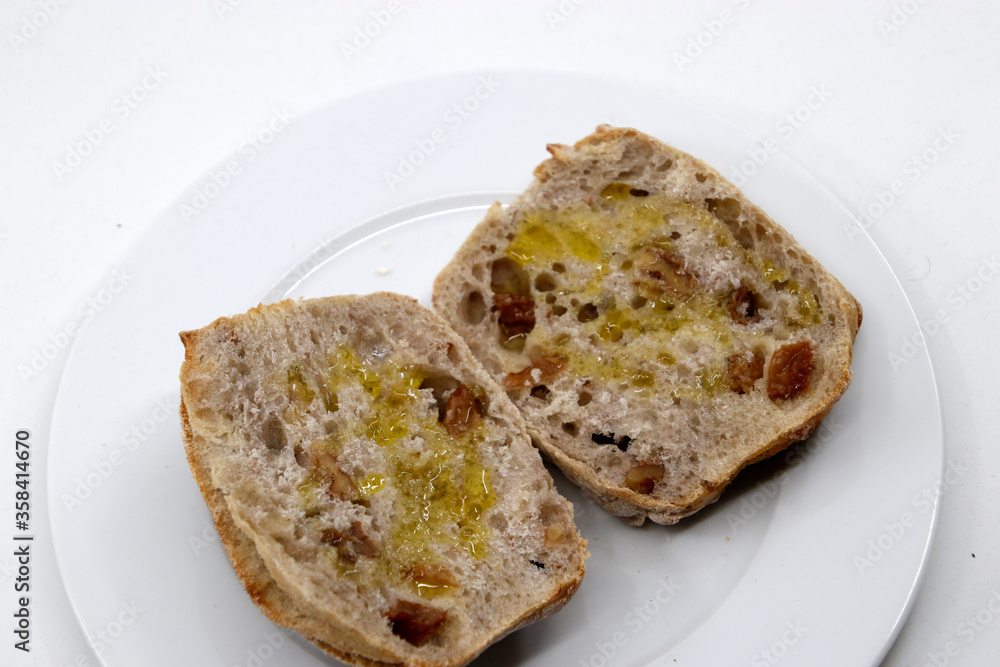 Two slices of bread with olive oil