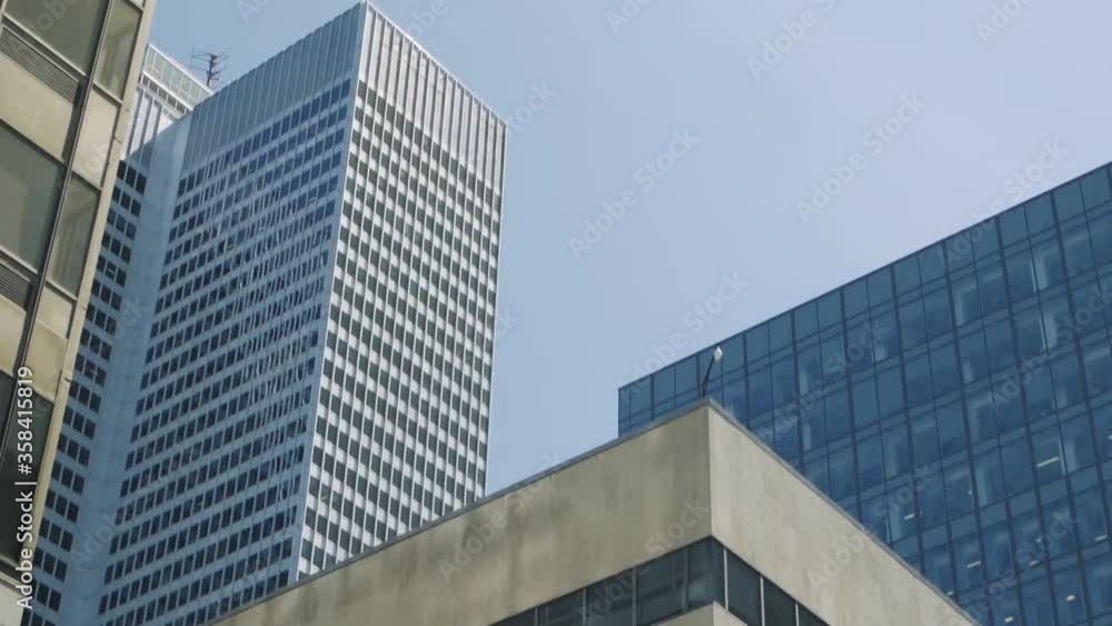 RBC Headquarters, Montreal, April 12, 2018 - Multiple tall and medium commercial building in the industrial areas with glass windows RBC Headquarters, Montreal, April 12, 2018 - Multiple tall and medium commercial building in the industrial areas with glass windows