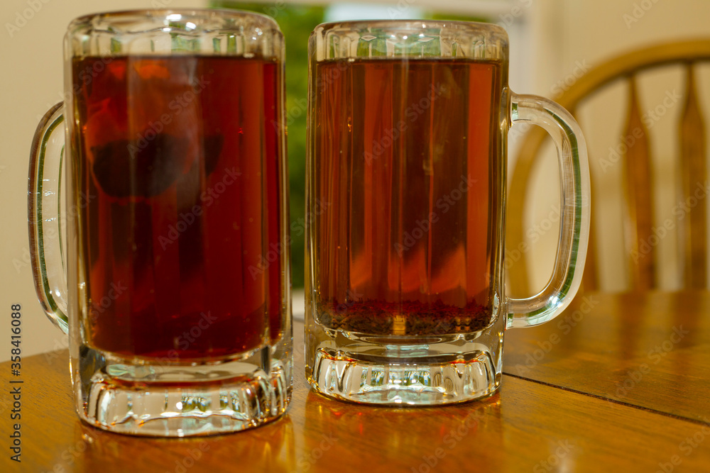 tea lovers' dream: black tea in glass bear mugs (isolated) tea lovers' dream: black tea in glass bear mugs (isolated)