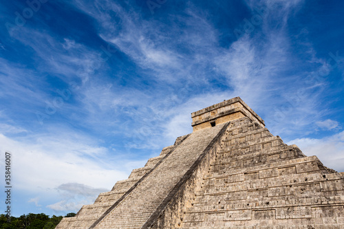 Low angle view of ancient pyramid of Kukulkan against cloudy sky