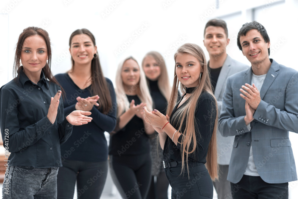 close up. group of happy employees applauding together close up. group of happy employees applauding together