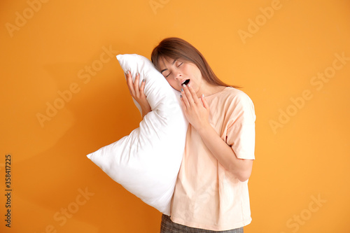 Tired woman with pillow on ...