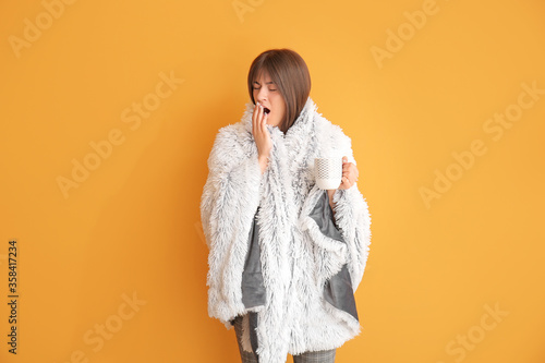 Tired woman with cup of tea...