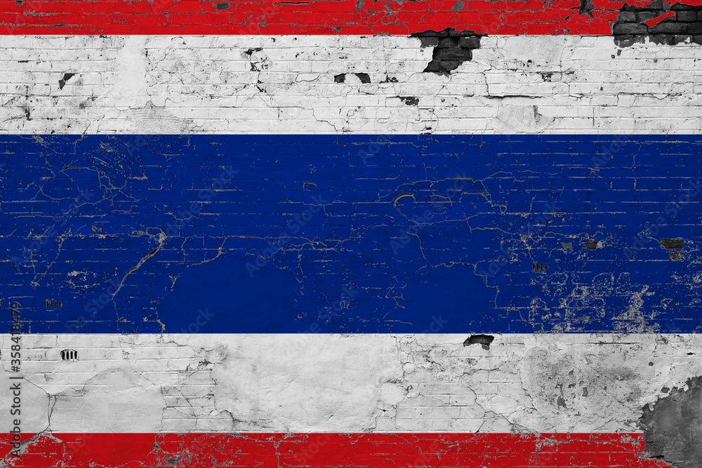 Thailand flag on grunge scratched concrete surface. National vintage background. Retro wall concept.