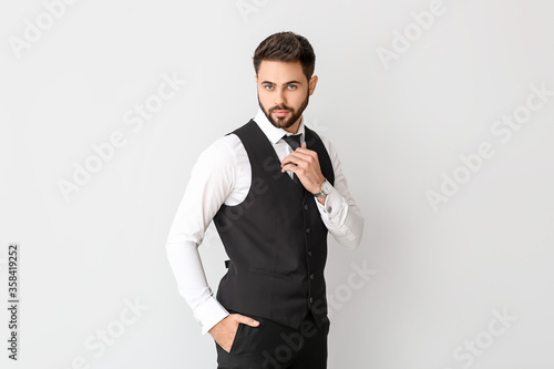 Fotografija Young man in formal clothes on light background