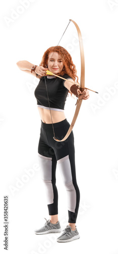 Fotografering Beautiful female archer with bow on white background