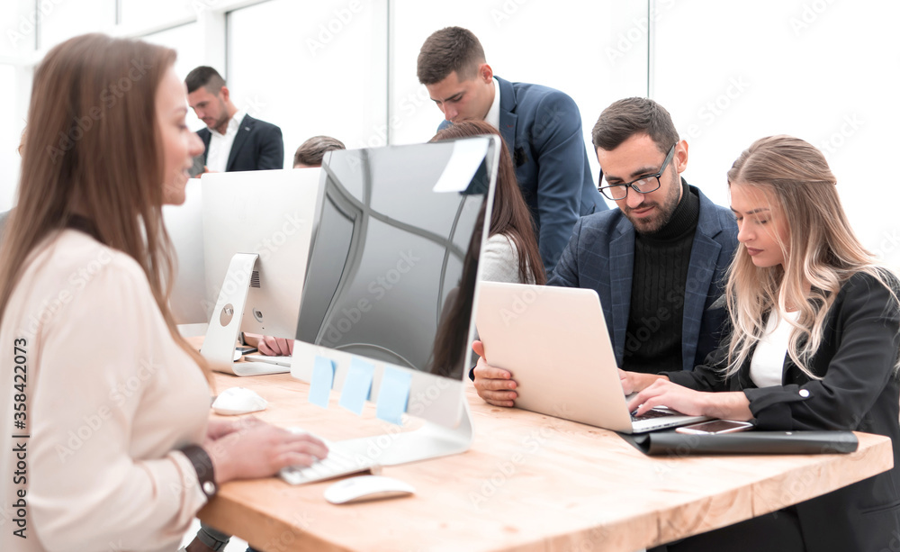 project Manager and business team sitting at the Desk project Manager and business team sitting at the Desk