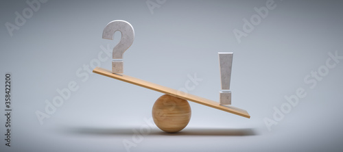 wooden scale balancing a question mark and an exclamation mark tipping more the right side on colorful background photo