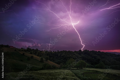 thunder lightning in the night over forest
