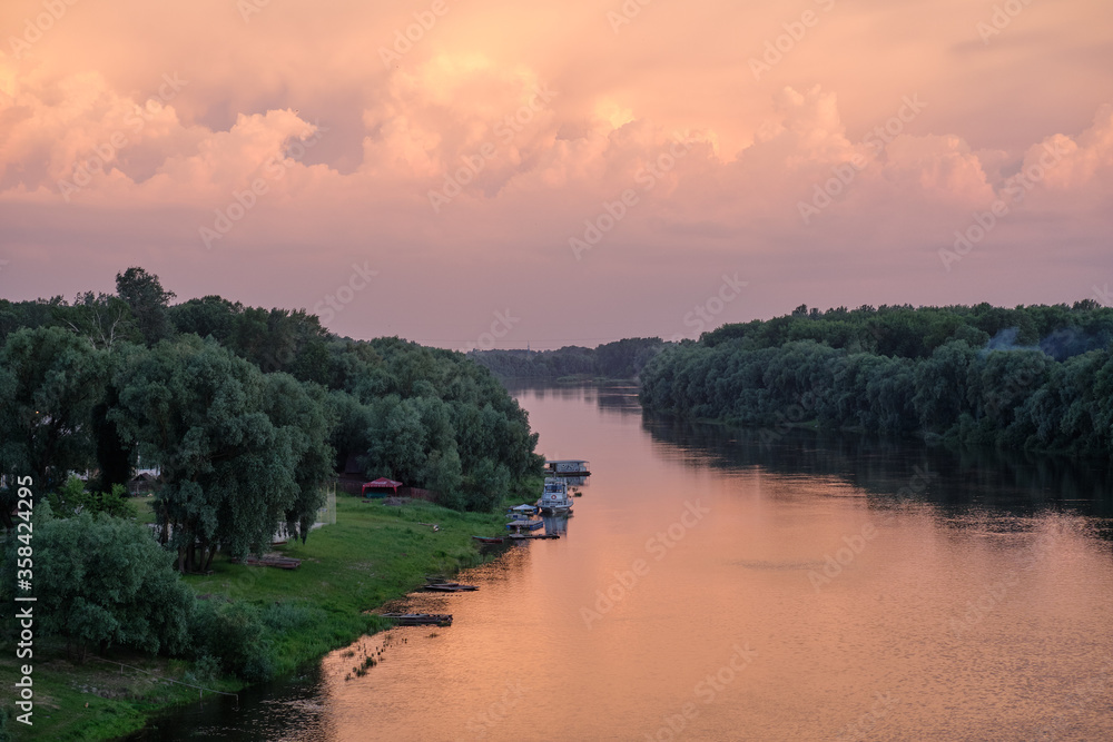 Obraz premium sunset over the river