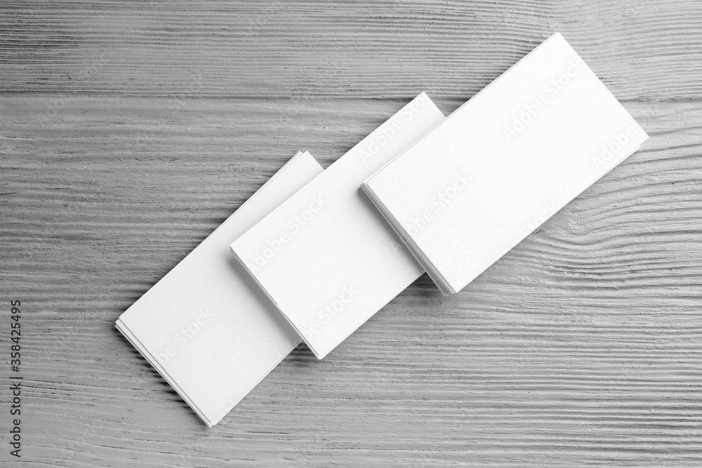 Blank business cards on wooden background Blank business cards on wooden background