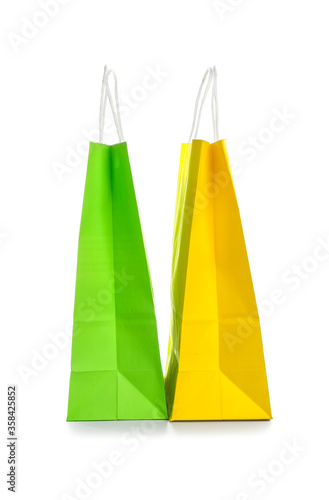 Paper shopping bags on white background