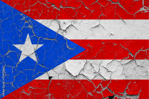 Puerto Rico flag close up grungy, damaged and scratched on wall peeling off paint to see inside surface. Vintage National Concept.