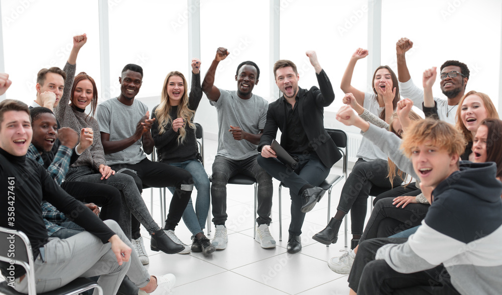 group of cheerful young people looking at the camera