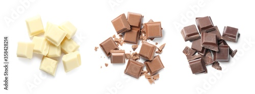 Set with different delicious chocolate pieces on white background  top view. Banner design
