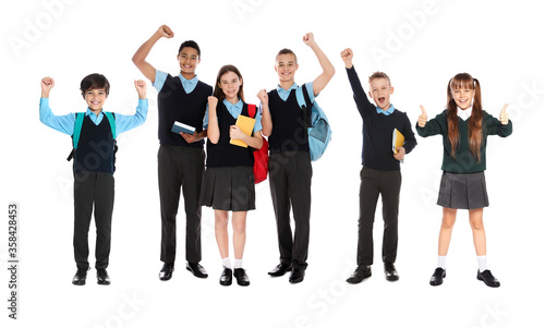 Children in school uniforms on white background