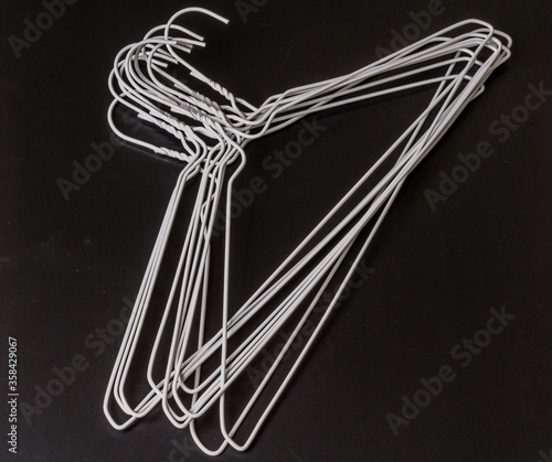 Stack of white wire clothes hangers