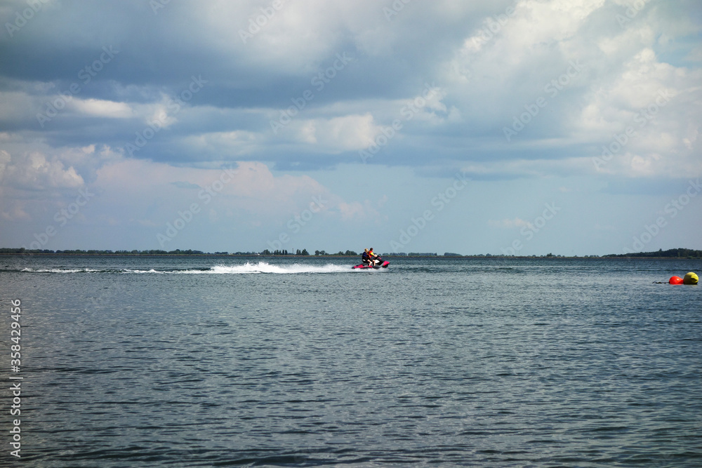 Obraz premium Sports water scooter ride on the lake