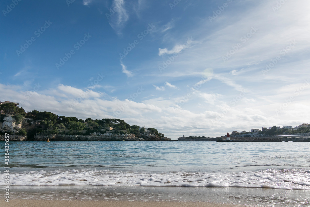 Sea and coast landscape with lighthouse in Porto Cristo