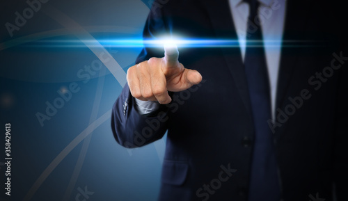 Man pressing button on virtual screen, closeup